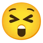 وجه مبتسم بعينين مغلقتين + وجه مندهش