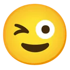 وجه يغمز + وجه بلسان متدلٍ وعين غامزة