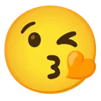وجه يرسل قبلة + قلب برتقالي