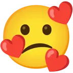 وجه مبتسم مع ثلاثة قلوب + وجه حائر
