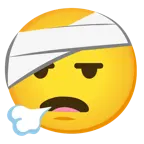 face exhaling + face with head-bandage