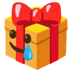 regalo + faccina sorridente con lacrima