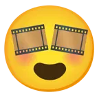 وجه مبتسم مع عينين على شكل قلب + شريط سينمائي