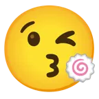 وجه يرسل قبلة + كعكة سمك بشكل حلزوني