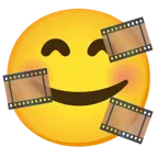 وجه مبتسم مع ثلاثة قلوب + شريط سينمائي