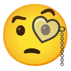 وجه مبتسم مع عينين على شكل قلب + وجه مع نظارة لعين واحدة