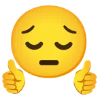 pulgar hacia arriba + cara desanimada