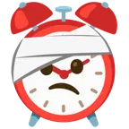 cara con la cabeza vendada + reloj despertador
