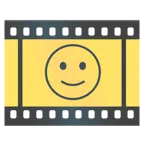 pellicola cinematografica + faccina con sorriso accennato